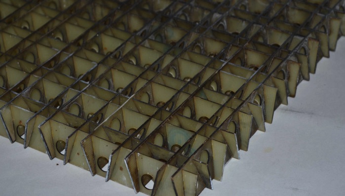 Система армирования бетонных строительных конструкций косоугольными объёмными решётками